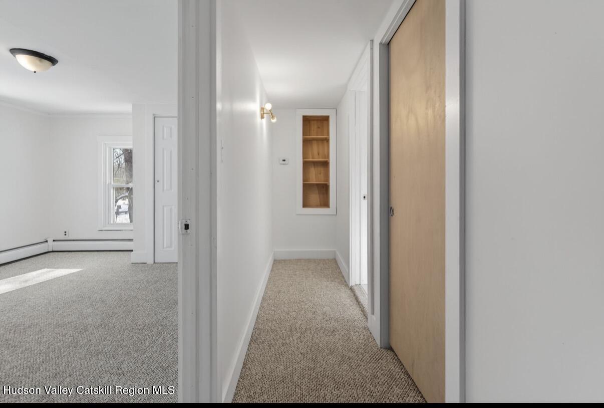 919 Elting Road Rosendale, NY 12472 - Photo 18 of 28 a view of a hallway with wooden floor