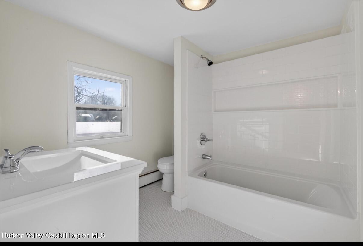919 Elting Road Rosendale, NY 12472 - Photo 20 of 28 a bathroom with a tub a sink and a window