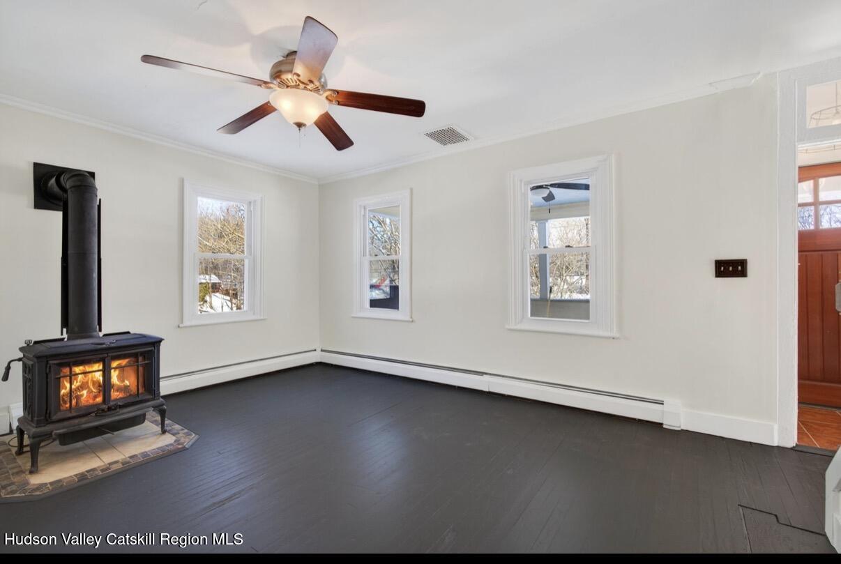 919 Elting Road Rosendale, NY 12472 - Photo 4 of 28 a view of an empty room with wooden floor and a window