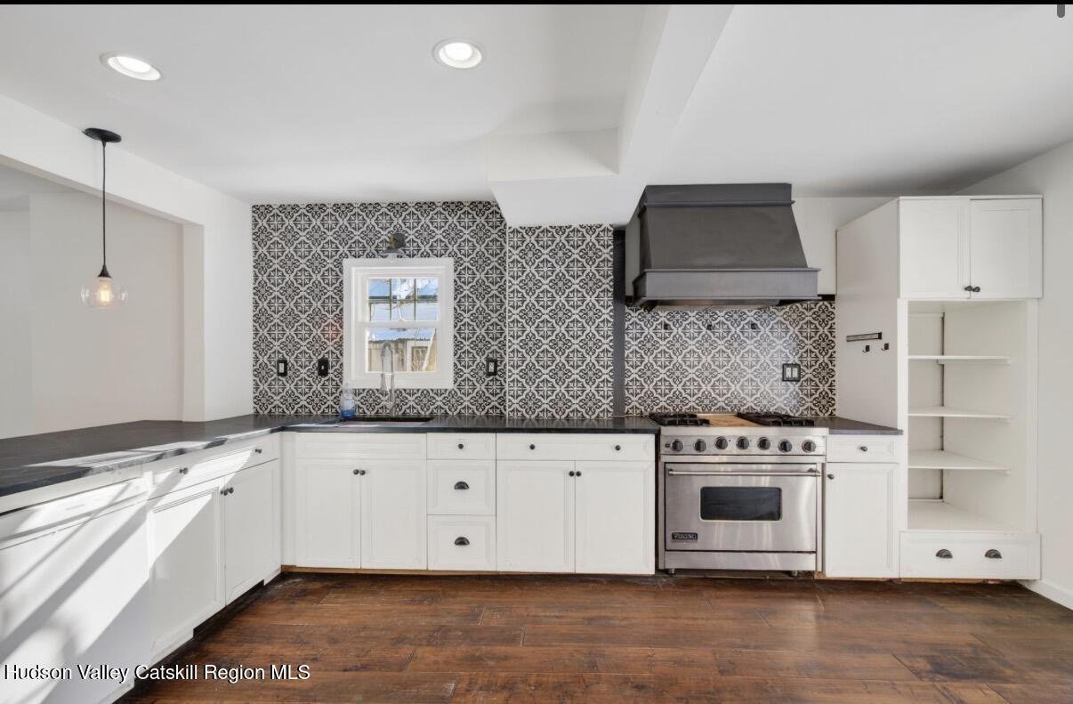 919 Elting Road Rosendale, NY 12472 - Photo 6 of 28 a kitchen with stainless steel appliances granite countertop a stove a sink and a white cabinets
