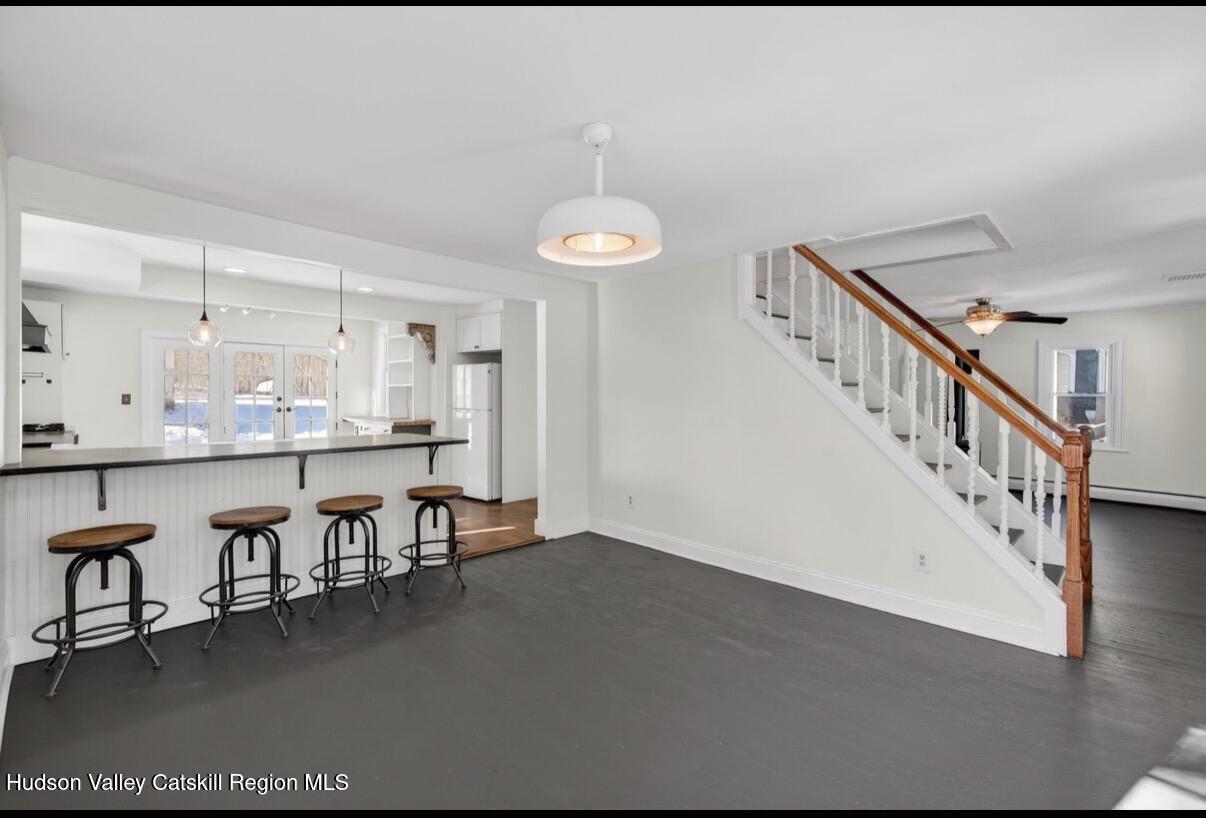 919 Elting Road Rosendale, NY 12472 - Photo 8 of 28 a room with lots of wooden furniture and a chandelier