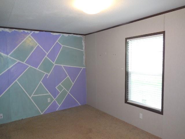 408 Bistineau Lake Road Ringgold, LA 71068 - Photo 2 of 10 an empty room with windows and a ceiling fan