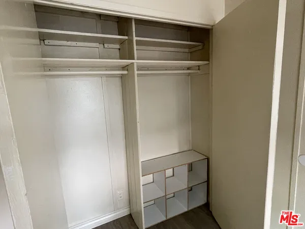 a view of an empty walk in closet