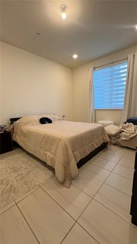 a bathroom with double vanity sinks and a mirror