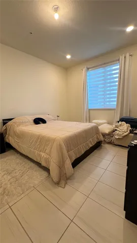 a bathroom with a double vanity sink a mirror and shower