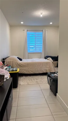 a view of a bathroom with mirror and a sink