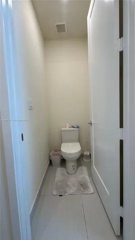 a bathroom with a sink vanity and a mirror