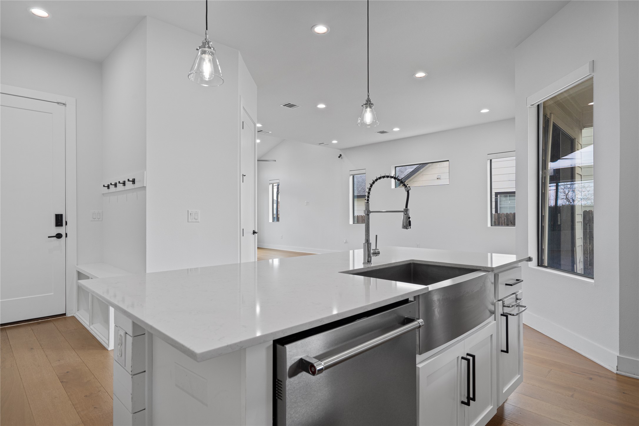 409 Delmar Avenue, Unit 1 Austin, TX 78752 - Photo 11 of 33 a kitchen with stainless steel appliances sinks and a refrigerator