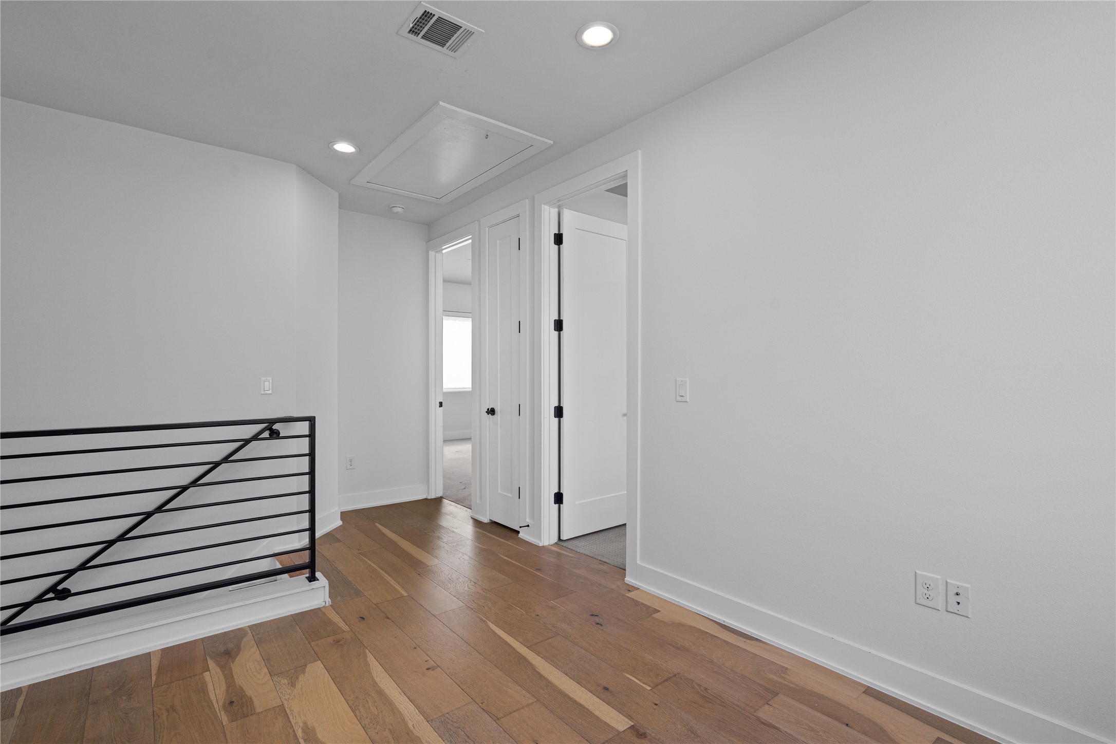 409 Delmar Avenue, Unit 1 Austin, TX 78752 - Photo 16 of 33 a view of a hallway with wooden floor