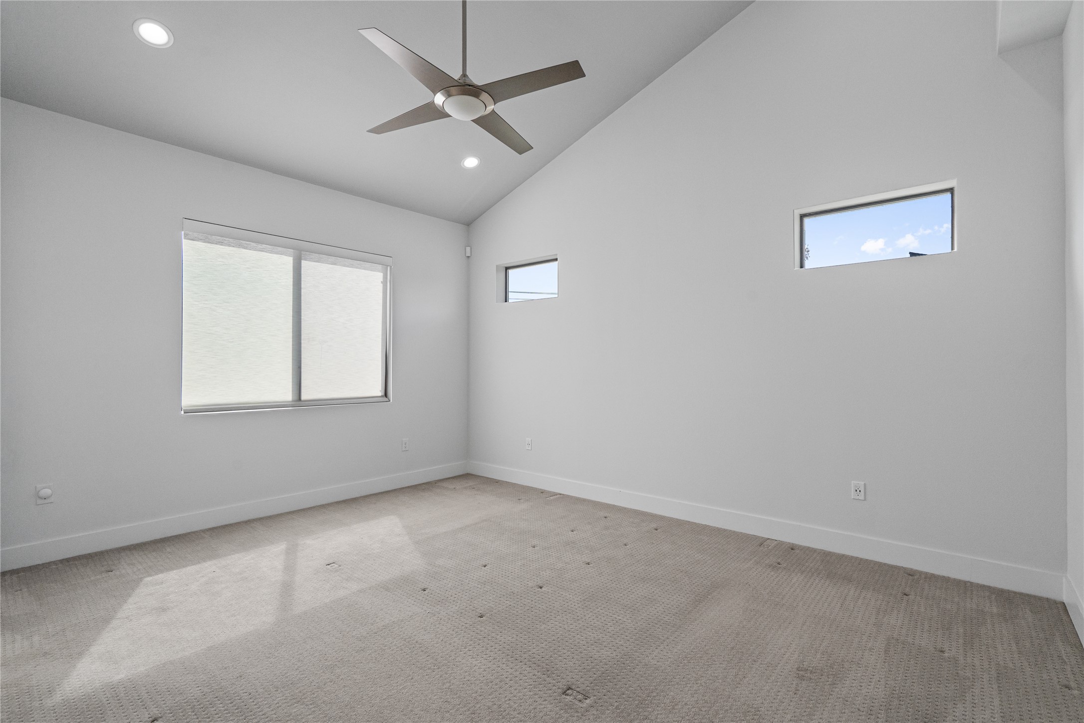 409 Delmar Avenue, Unit 1 Austin, TX 78752 - Photo 17 of 33 en empty room with windows and ceiling fan