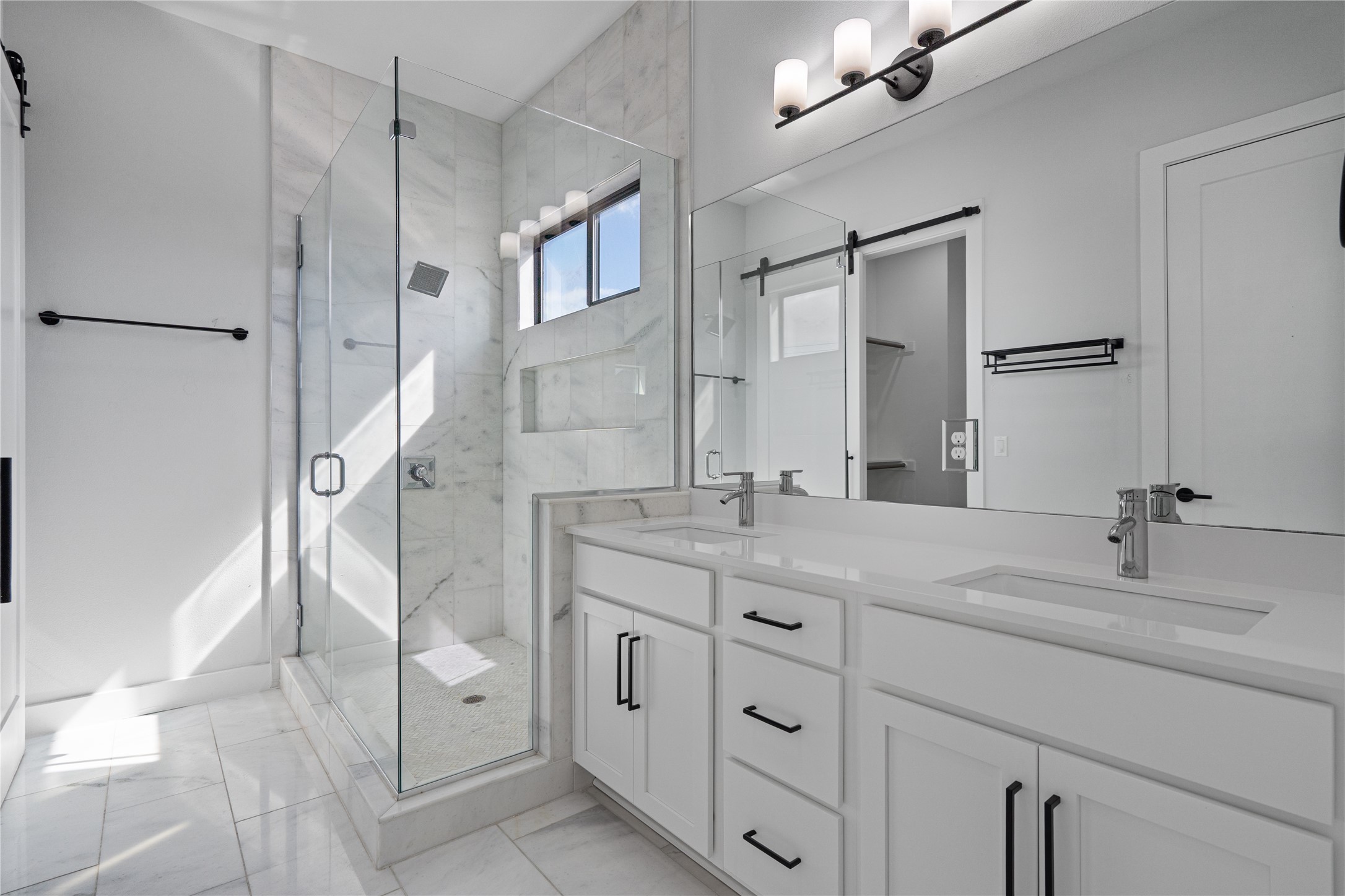 409 Delmar Avenue, Unit 1 Austin, TX 78752 - Photo 19 of 33 a bathroom with a double vanity sink mirror and shower