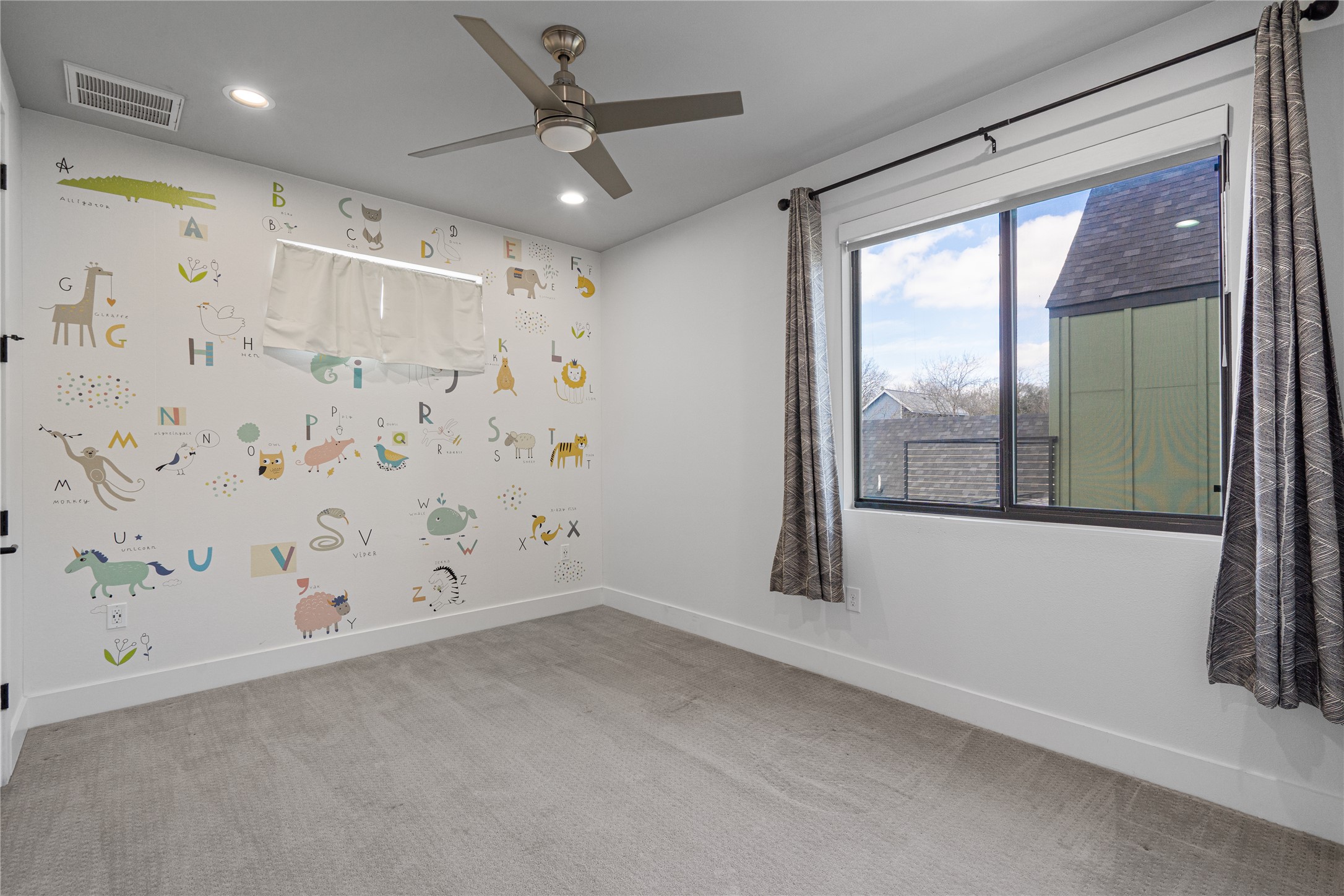 409 Delmar Avenue, Unit 1 Austin, TX 78752 - Photo 22 of 33 a view of an empty room with a window