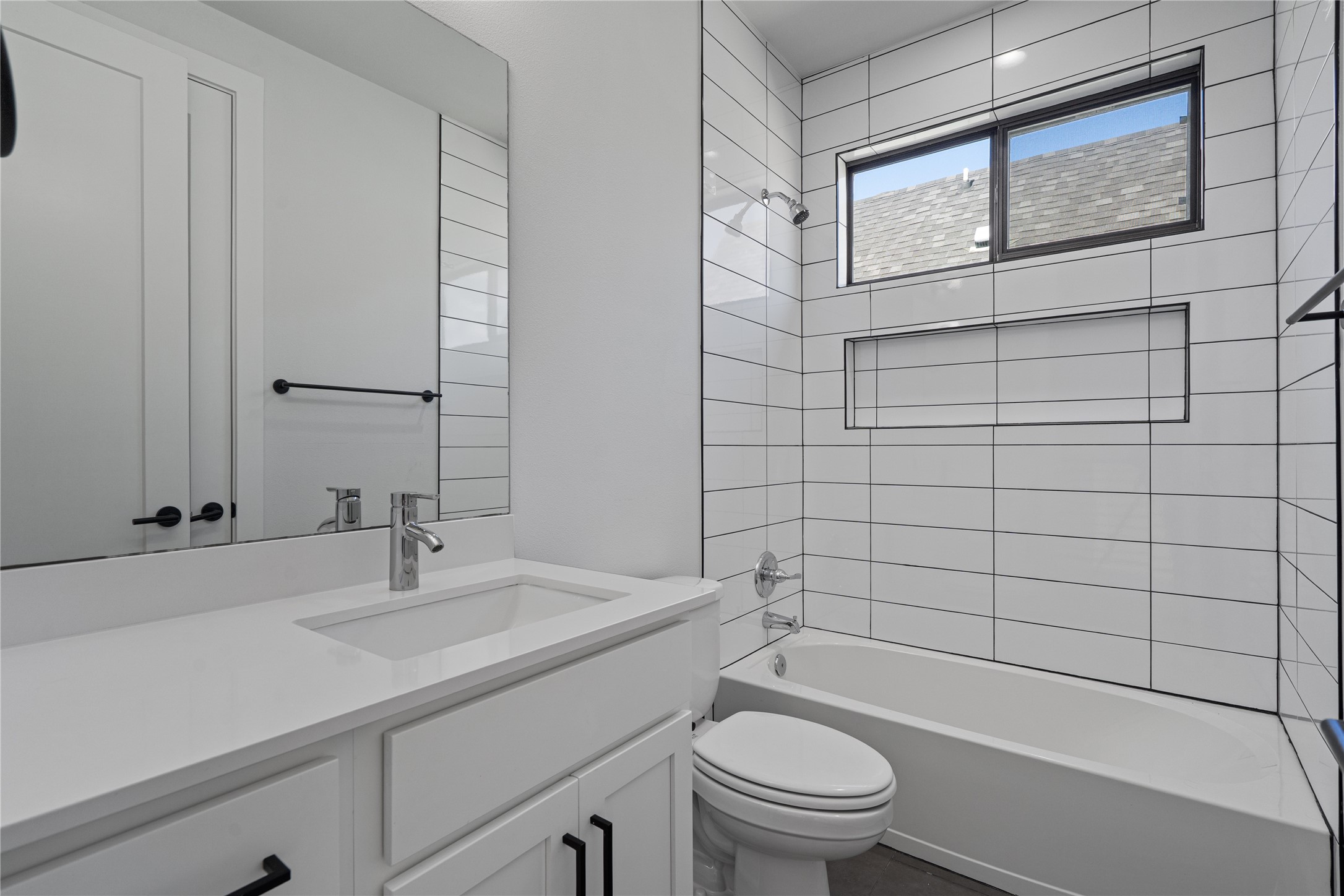 409 Delmar Avenue, Unit 1 Austin, TX 78752 - Photo 26 of 33 a bathroom with a sink toilet and shower