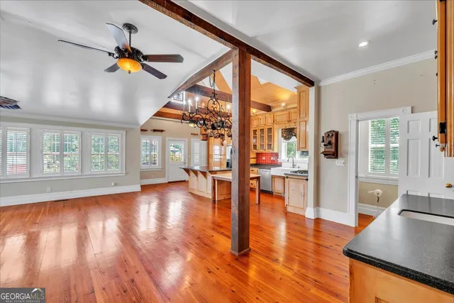 a view of a room with wooden floor