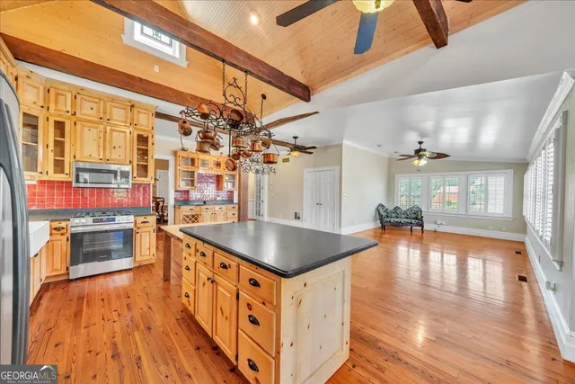 a bathroom with a sink toilet a mirror and tub