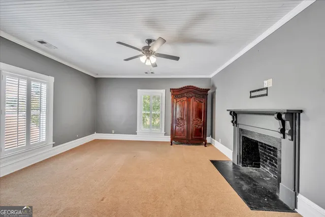 a view of a house with a backyard and a garage
