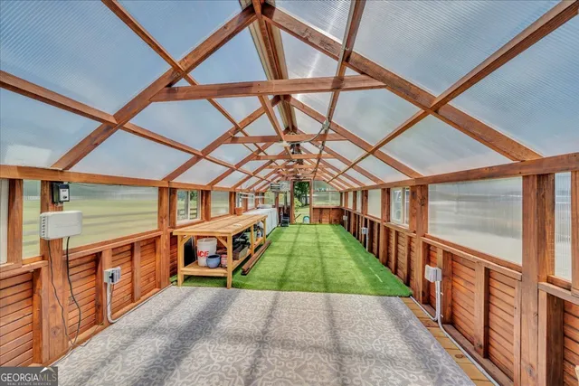 a view of a swimming pool with a table and chairs