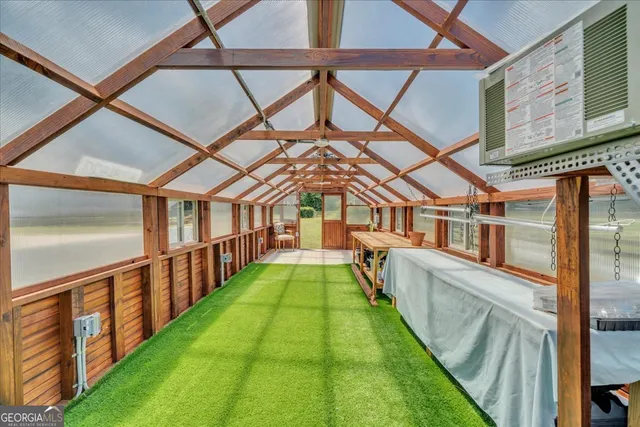 a view of a house with pool and a yard