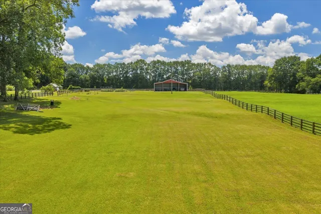 a front view of a house with a lake view