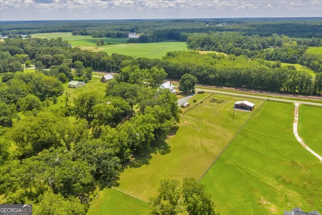 a view of a porch with furniture and a yard