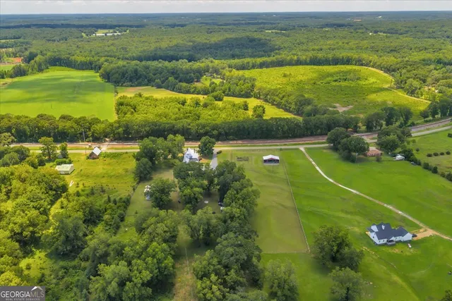 a view of a swimming pool with a yard