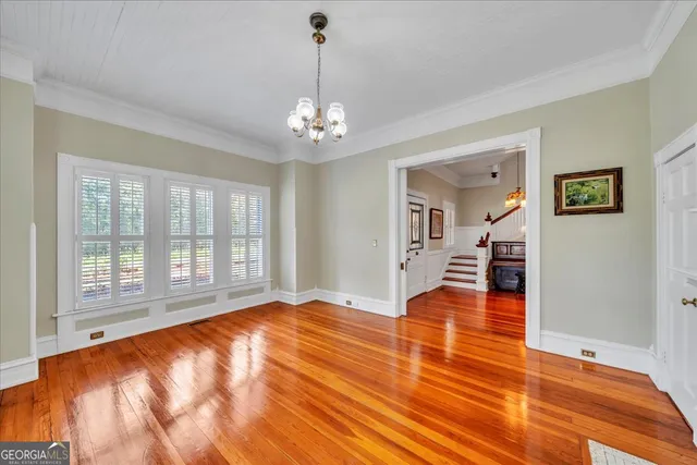 a living room with fireplace furniture and a chandelier