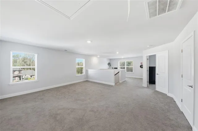 a view of a big room with windows and cabinet