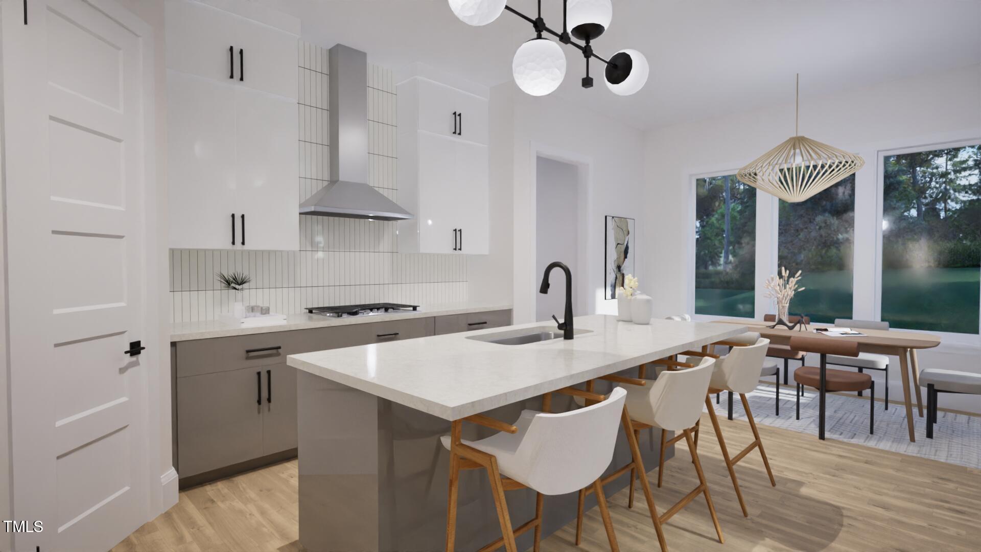 1806 Pershing Road Raleigh, NC 27608 - Photo 7 of 36 a kitchen with stainless steel appliances a table chairs and a wooden floor