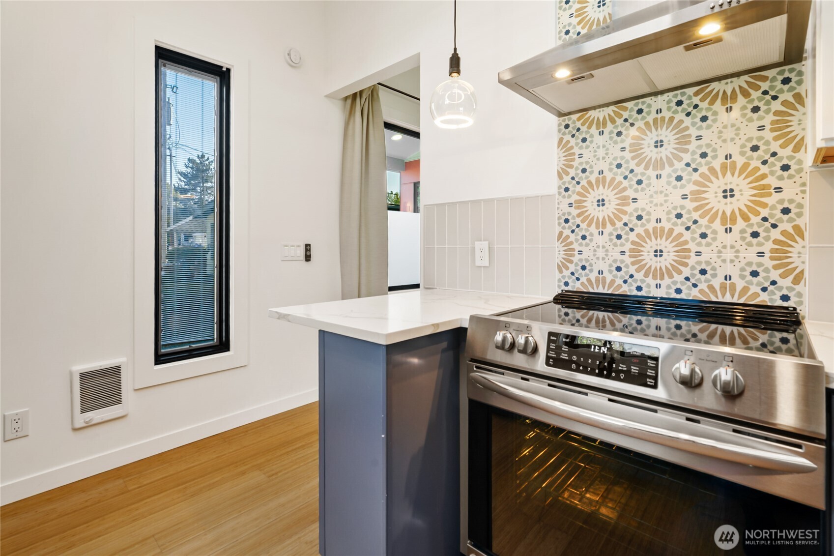 1645 South 272nd Street, Unit 55 Federal Way, WA 98003 - Photo 11 of 27 a kitchen with a stove and a microwave
