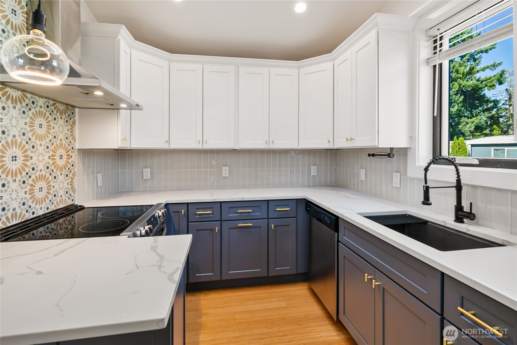 1645 South 272nd Street, Unit 55 Federal Way, WA 98003 - Photo 12 of 27 a kitchen with granite countertop a sink a stove and cabinets