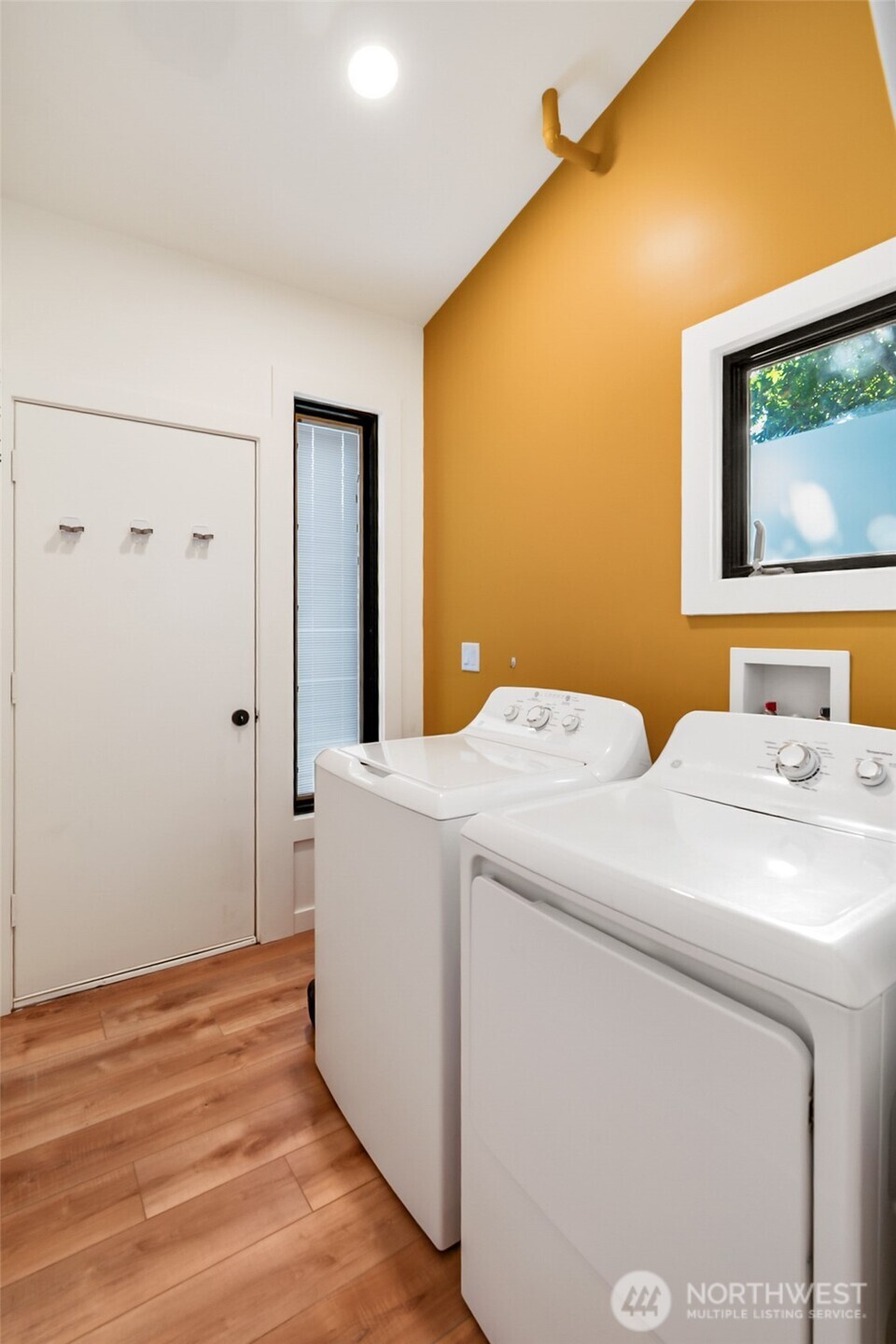 1645 South 272nd Street, Unit 55 Federal Way, WA 98003 - Photo 18 of 27 a bedroom with a bed and a flat screen tv