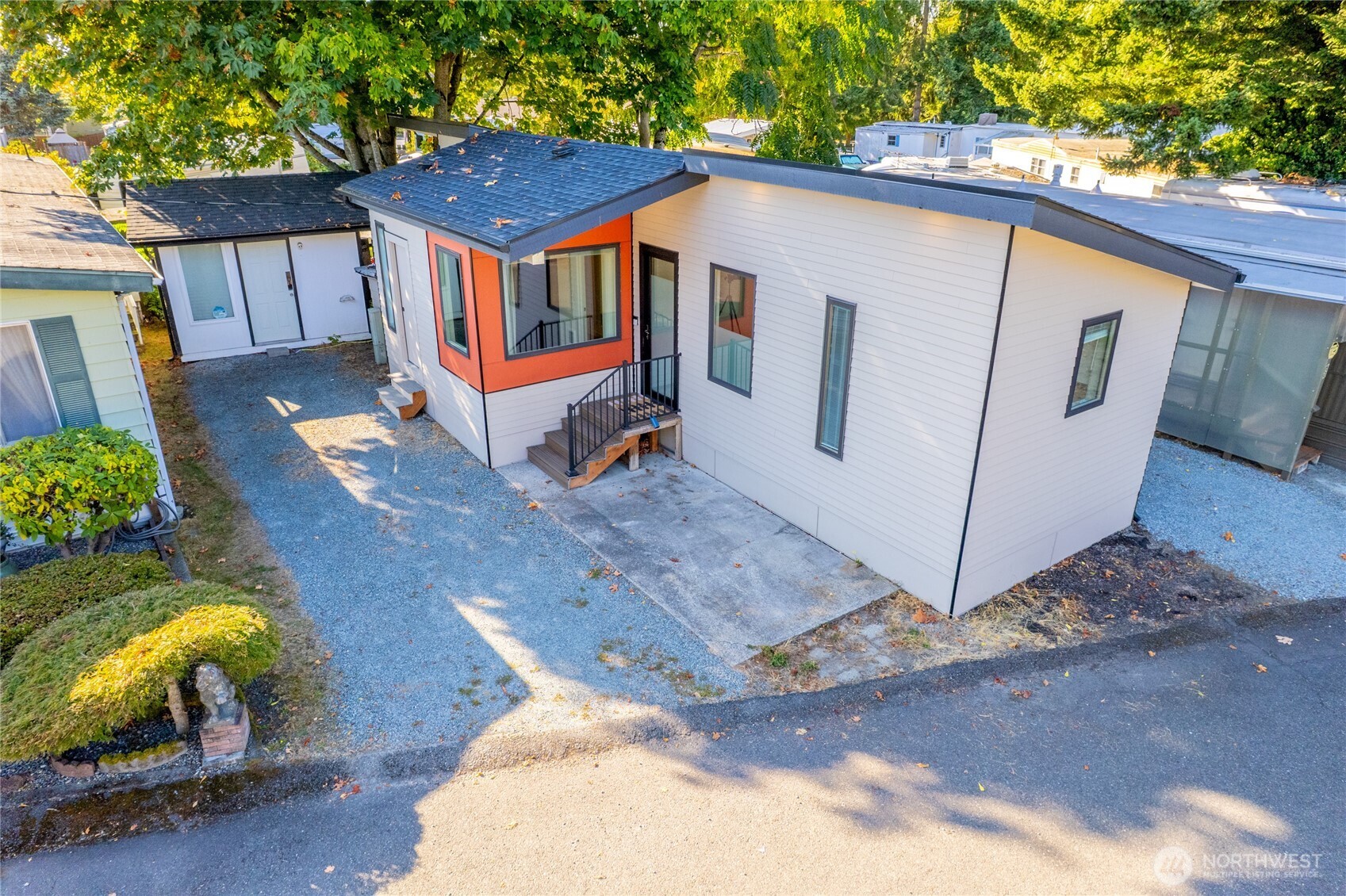 1645 South 272nd Street, Unit 55 Federal Way, WA 98003 - Photo 24 of 27 a view of a small house with yard