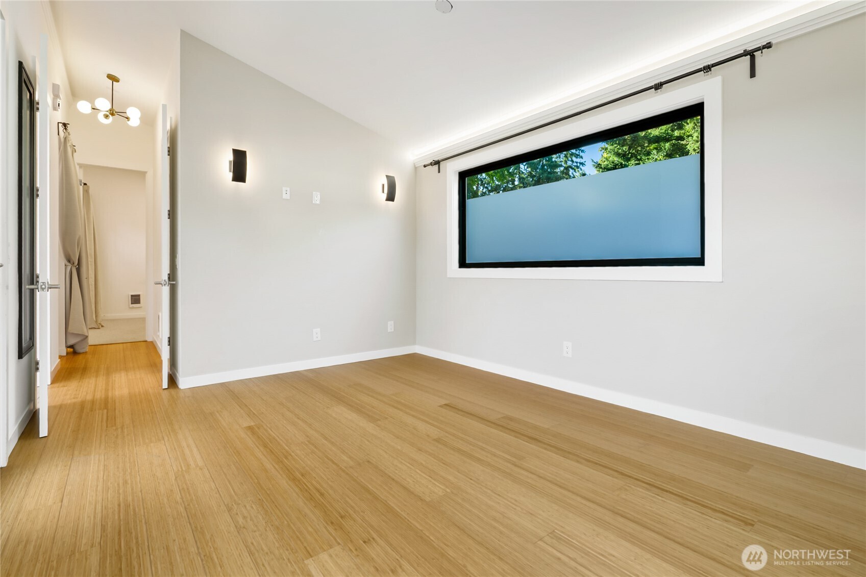 1645 South 272nd Street, Unit 55 Federal Way, WA 98003 - Photo 5 of 27 a view of a room with wooden floor