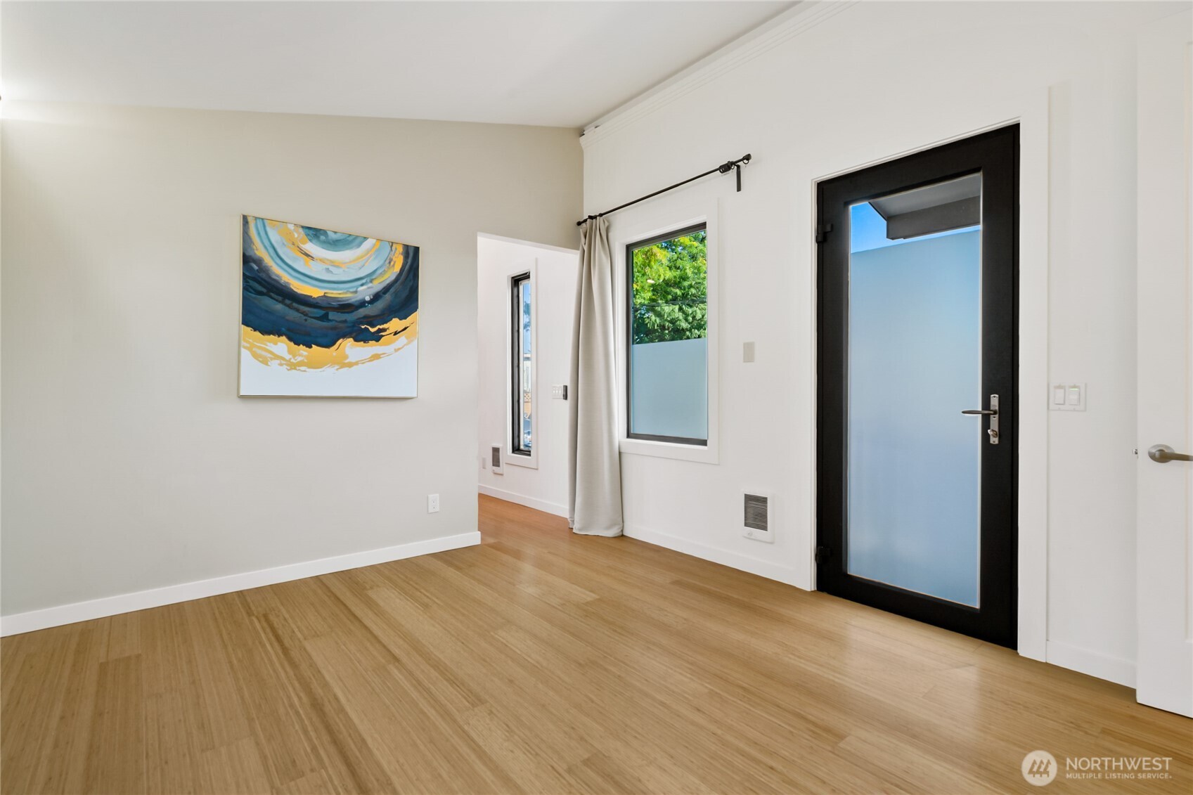 1645 South 272nd Street, Unit 55 Federal Way, WA 98003 - Photo 6 of 27 a view of an empty room with painting on the wall