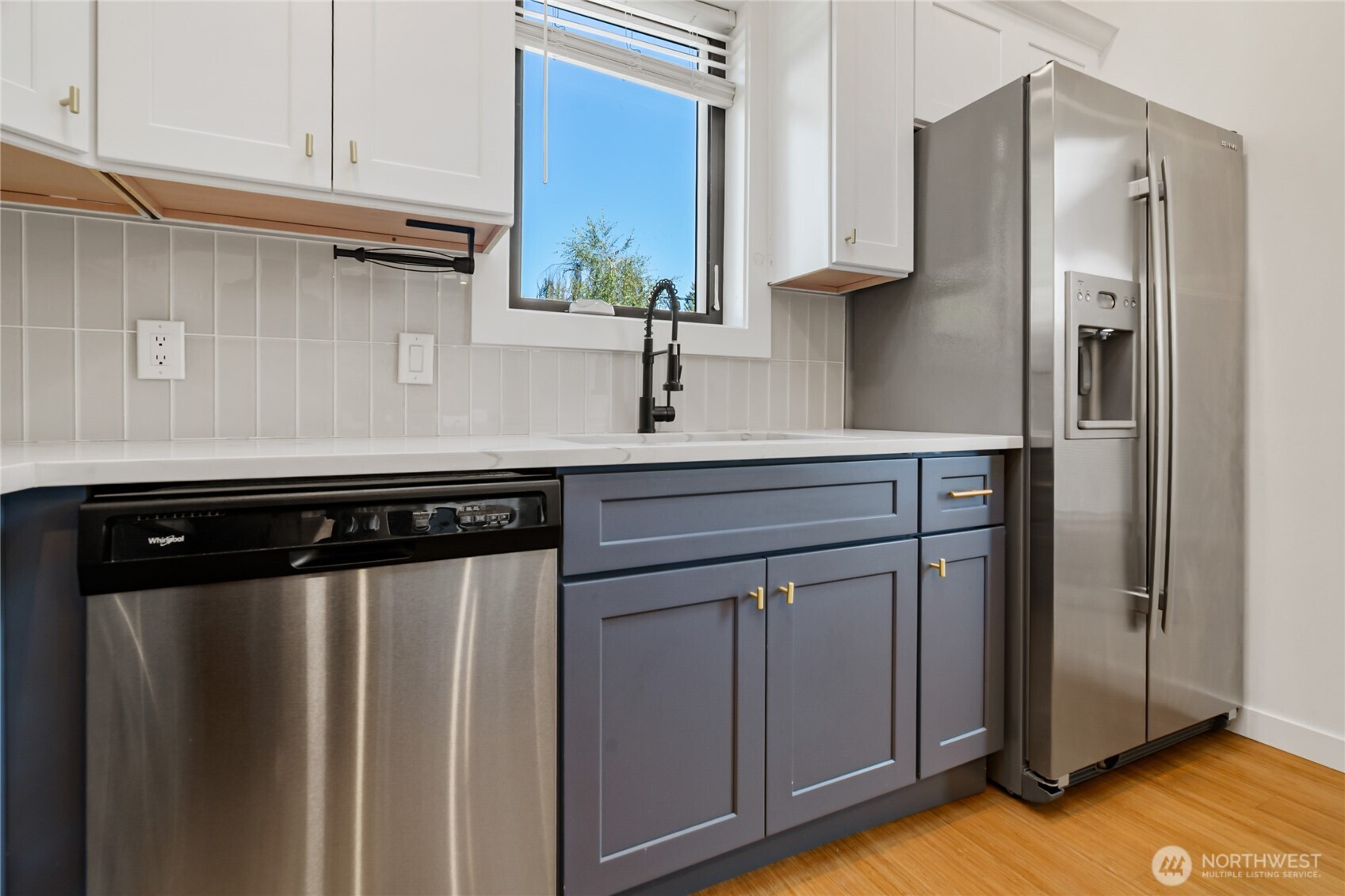 1645 South 272nd Street, Unit 55 Federal Way, WA 98003 - Photo 10 of 27 a kitchen with stainless steel appliances a refrigerator a sink and cabinets