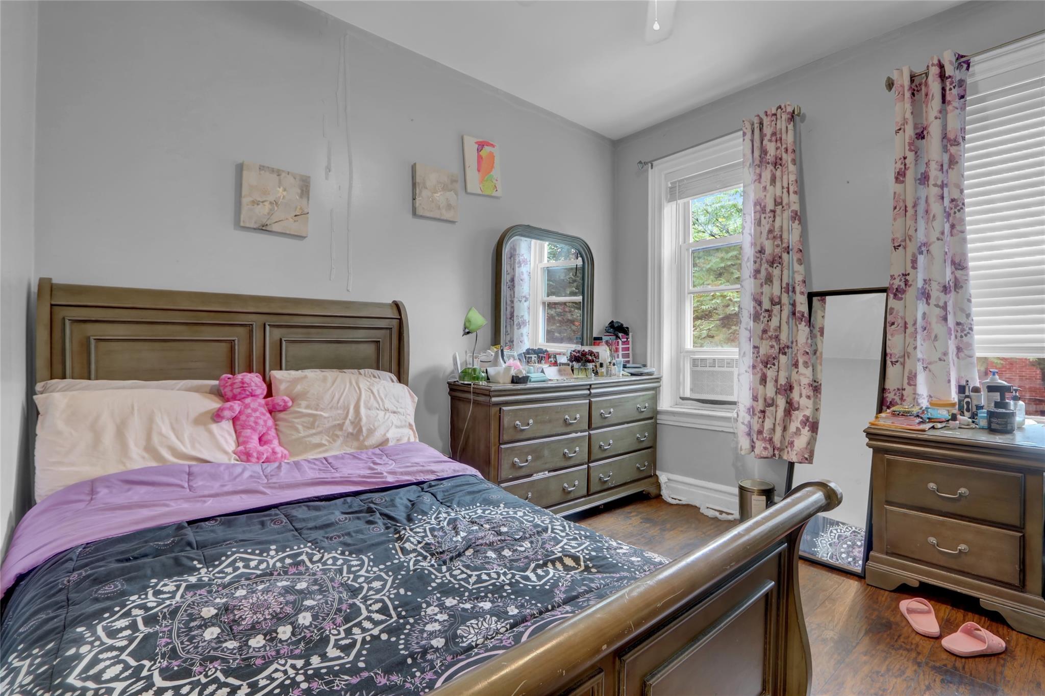 31 Tapscott Street Brooklyn, NY 11212 - Photo 10 of 10 Bedroom with dark wood-style flooring