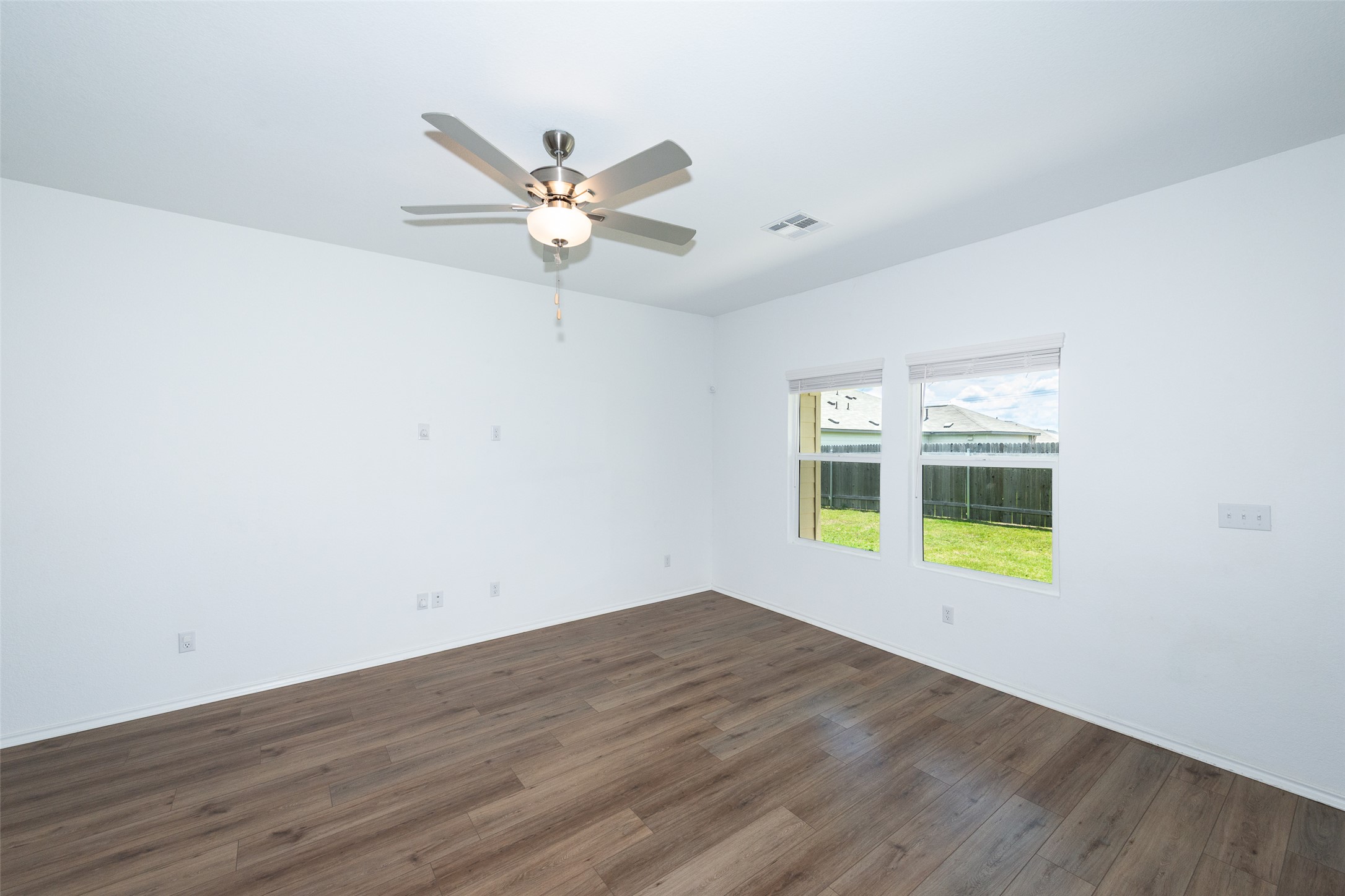 147 Otter Road Kyle, TX 78640 - Photo 16 of 34 Living area facing rear of property and back covered back patio