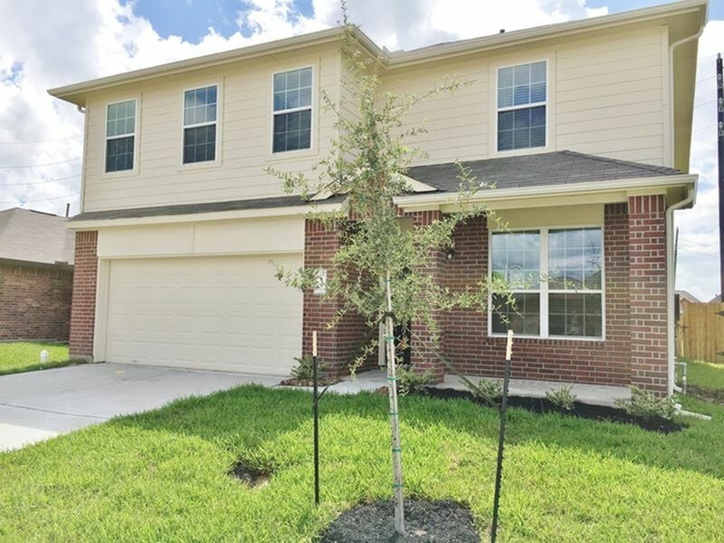 a view of house with backyard