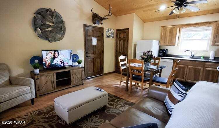 97 Rohrer Road Greer, AZ 85927 - Photo 7 of 14 a living room with furniture rug and window