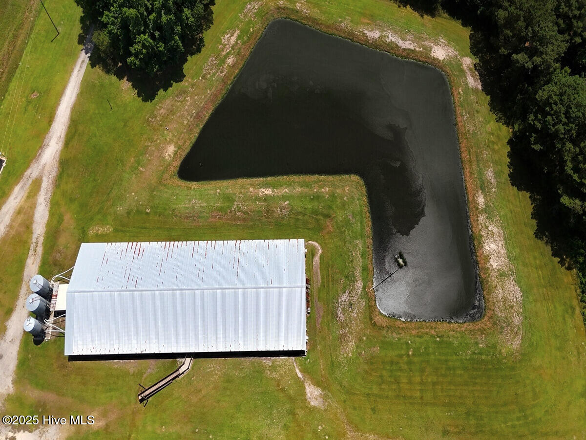 481 Nine Mile Road Maple Hill, NC 28454 - Photo 42 of 43 42. Livestock Barn & Waste Lagoon