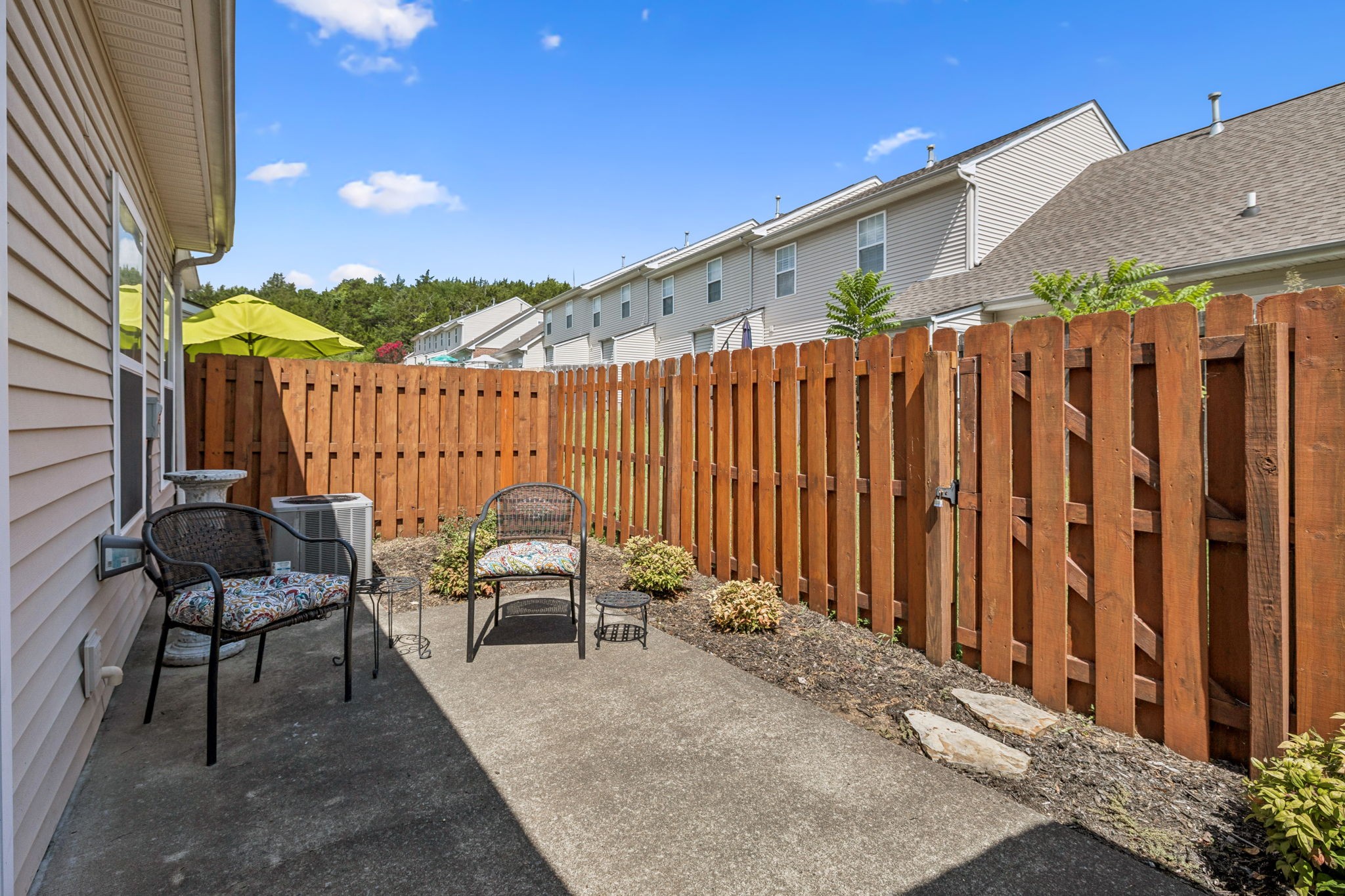 1101 Downs Boulevard, Unit 316 Franklin, TN 37064 - Photo 24 of 26 a balcony with chairs and a potted plant