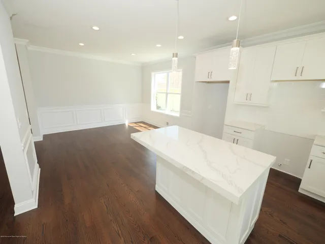 a view of kitchen with wooden floor