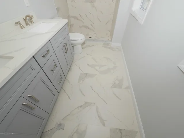 a bathroom with a sink and toilet