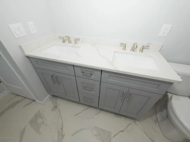 a bathroom with a sink and a toilet