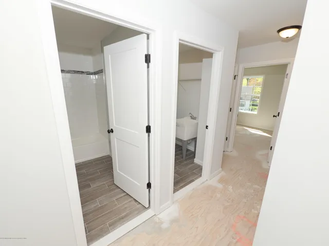 a view of a bathroom with a glass door shower