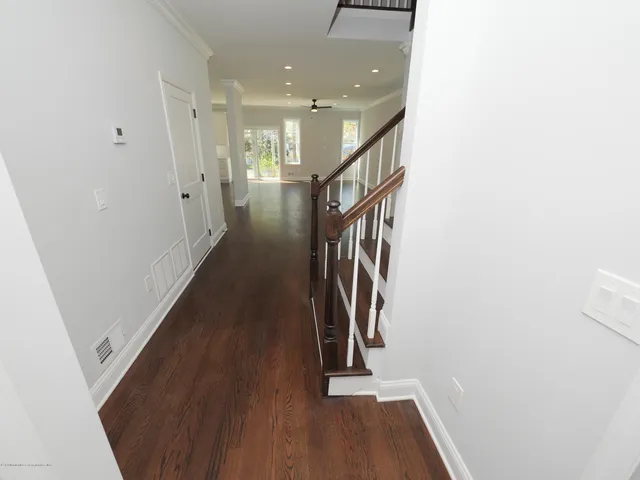 a view of entryway with wooden floor
