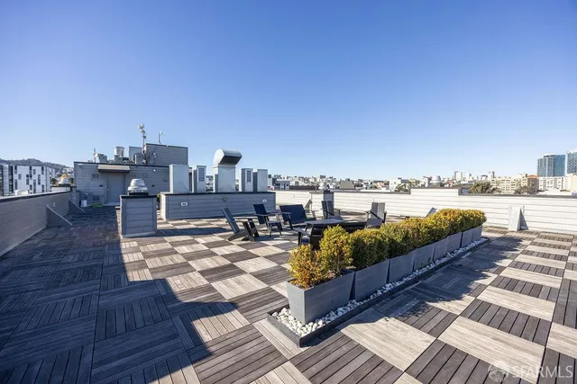 a view of a terrace with sitting area