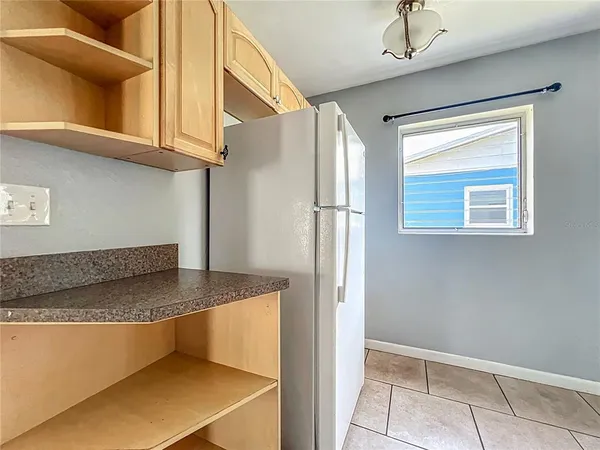 a view of a refrigerator a sink and dishwasher