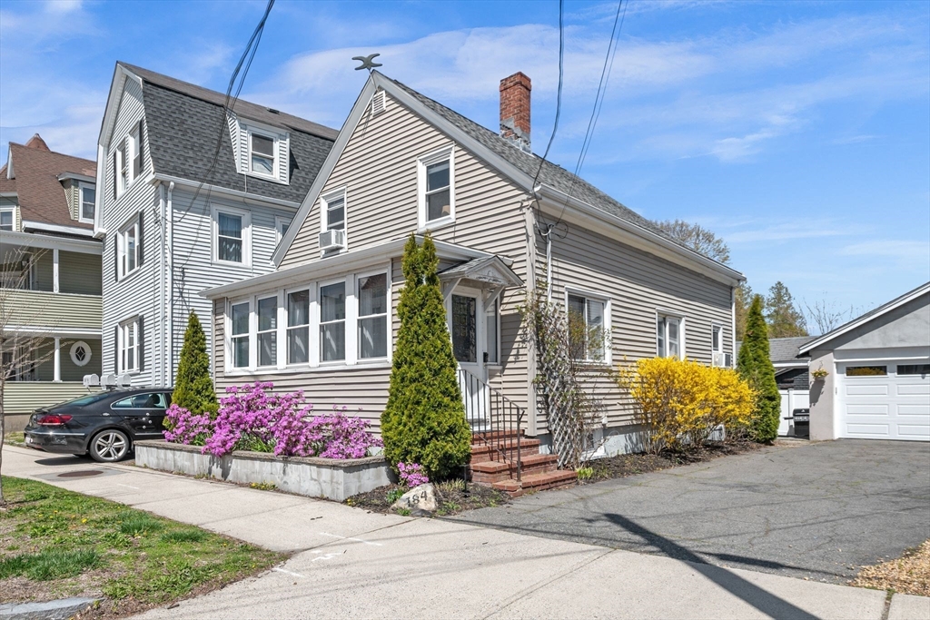 184 North Street Salem, MA 01970 - Photo 1 of 39 a front view of a house with garden