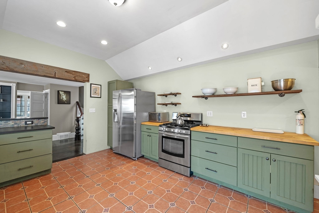 184 North Street Salem, MA 01970 - Photo 21 of 39 a kitchen with stainless steel appliances granite countertop a sink and cabinets